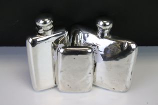 Two silver hallmarked hip flasks both with hinged lids (one hallmarked Chester 1906, the other