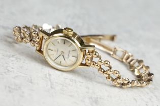 Omega ladymatic yellow gold wristwatch, circular dial, baton numeral markers, pencil hands, 9ct gold