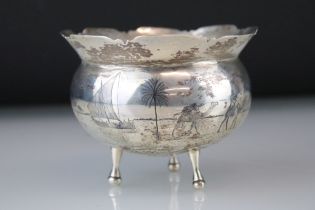 1930s Iraqi white metal bowl having a flared rim with a shaped rim, having a Niello work scene to