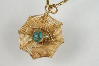 Turquoise and seed pearl 9ct yellow gold pendant necklace, modelled as a spider and spider web,