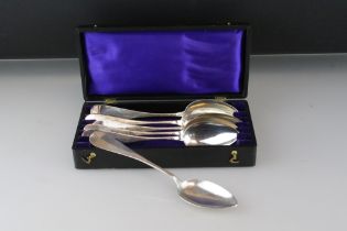 Set of six 800 continental silver spoons having rounded terminals and engraved initials, in original