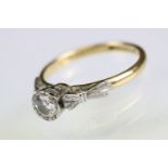 Diamond solitaire 18ct yellow gold and platinum set ring, the round brilliant cut diamond weighing
