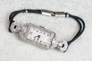 Art Deco diamond platinum ladies cocktail watch, rectangular dial, black Arabic numerals and poker