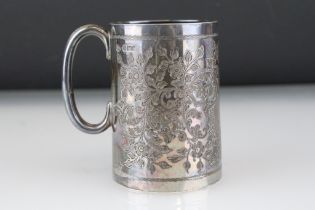 Edwardian silver cup, tapered body with engraved floral and foliate decoration, C shaped handle,