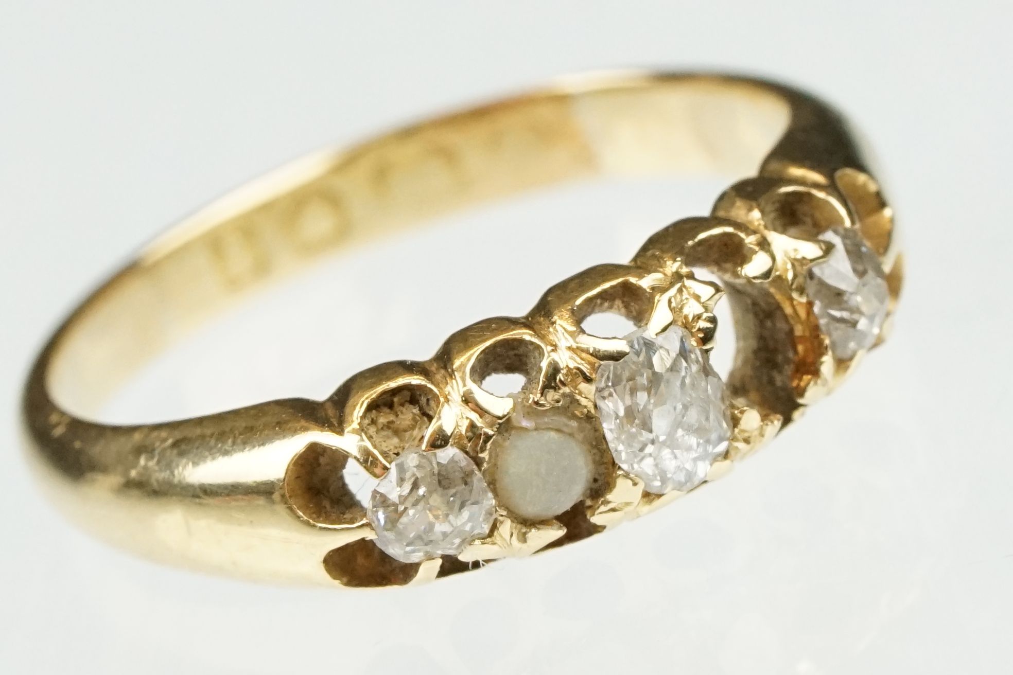 Victorian diamond and pearl yellow gold ring. three old cut diamonds, single seed pearl, one
