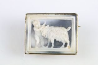 19th century yellow metal cameo depicting a goat and putto, rubover closed back setting, hinged