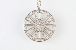 Belle Epoque diamond white metal pendant necklace, the pierced circular pendant with principal round
