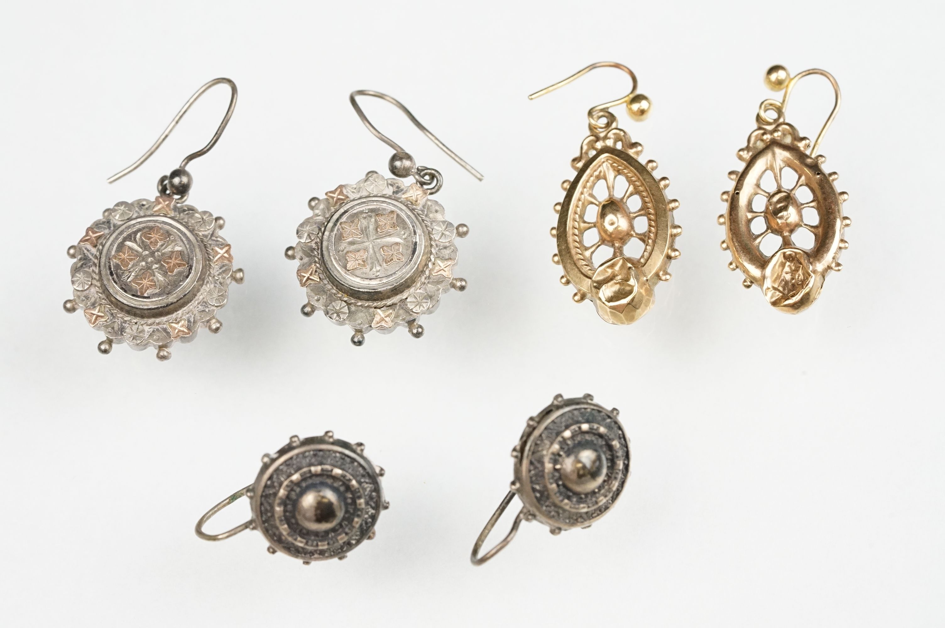 Three pairs of 19th Century Victorian earrings to include a pair of 9ct gold drop earrings, and