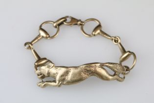 9ct yellow gold bracelet with central section modelled as a fox, the links modelled as riding