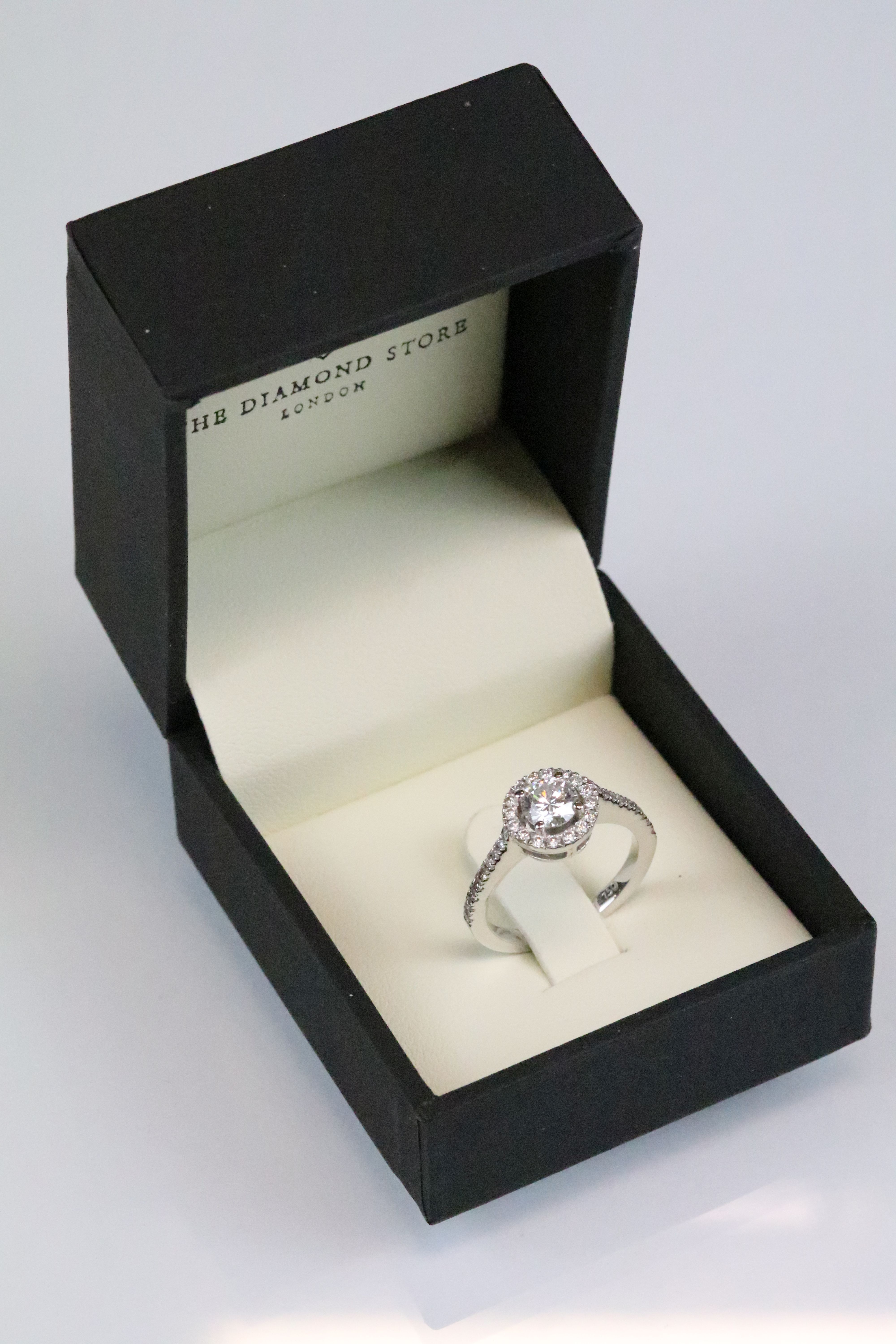Diamond 18ct white gold halo cluster ring, the round brilliant cut diamond to centre weighing approx
