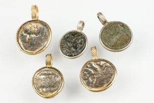 Five various Greek-style coins in yellow and white metal pendant mounts