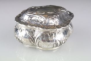 Late 19th century silver trinket pot, repoussé floral and foliate scroll decoration throughout,