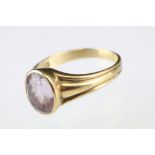 Amethyst 9ct yellow gold ring, the oval mixed cut amethyst measuring approx 9 x 7mm, rubover set,
