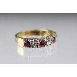 Ruby and diamond 18ct yellow and white gold set ring, four round mixed cut rubies, three round