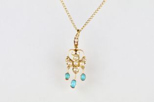 Edwardian turquoise and seed pearl 15ct yellow gold pendant, the central flower head motif set