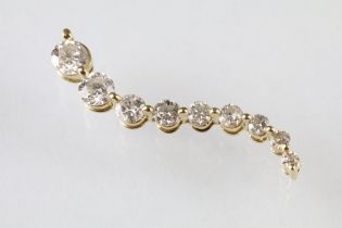 Diamond 14ct yellow gold S shaped pendant, nine graduated round brilliant cut diamonds, the