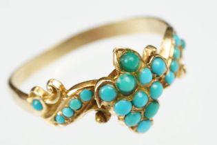 19th century turquoise unmarked yellow gold ring, the central cluster comprising eleven small