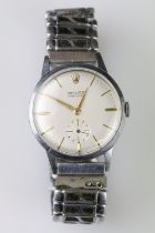 Vintage Rolex Precision stainless steel wrist watch. The watch having a cream dial with gilt baton