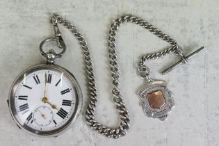 Silver open face key wind pocket watch, white enamel dial and seconds dial, black Roman numerals,