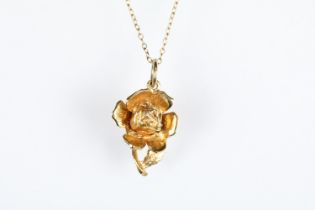 9ct gold rose pendant, length approx 2cm, yellow metal chain, base metal safety chain