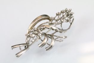 Diamond white metal spray brooch, small round eight cut diamonds, textured stylised leaves,