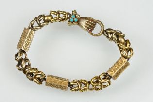 19th century garnet and turquoise yellow metal bracelet, the clasp modelled as a hand holding a