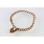 Early 20th century 9ct rose gold curb link bracelet, padlock clasp with engraved initials, safety