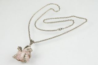 Brutalist rose quartz unmarked silver pendant necklace, the rough rose quart with abstract