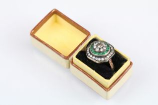 Diamond and emerald rose metal ring, the central round brilliant cut diamond weighing approx 0.15