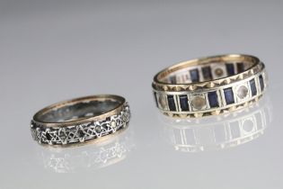 Two 20th Century eternity rings to include one 9ct gold example set with blue and white stones (