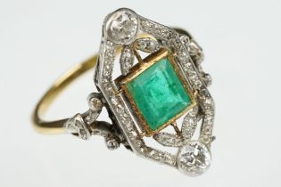 Art Deco emerald and diamond unmarked yellow gold and platinum ring, the square step cut emerald