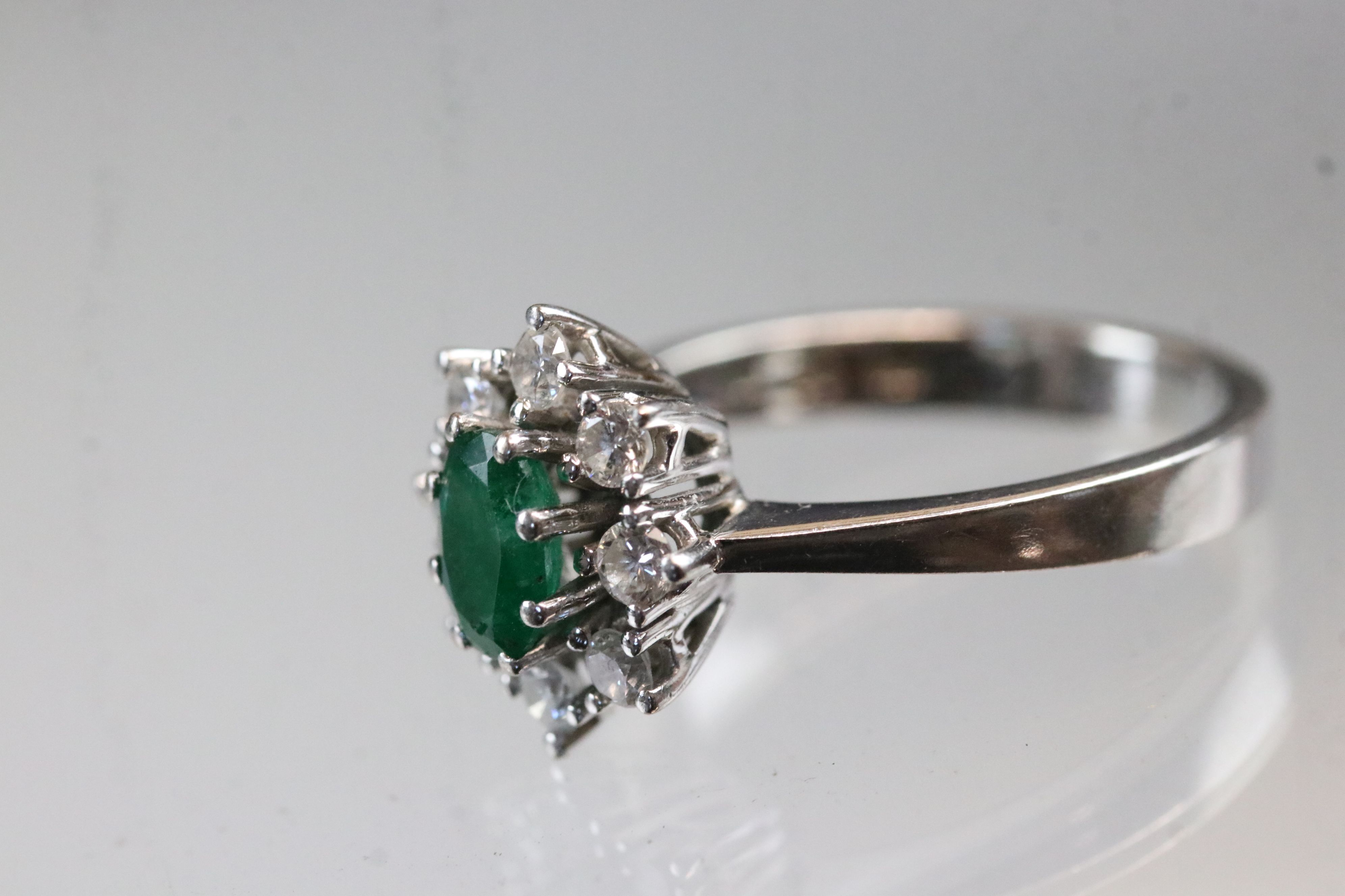 Emerald and diamond 18ct white gold cluster ring, oval mixed cut emerald, dimensions approx 6 x 4mm, - Image 3 of 5