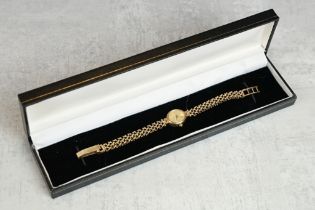 Ladies 9ct yellow gold wristwatch, oval dial, baton numeral markers, pencil hands, 9ct gold bracelet