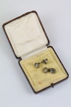 Pair of 18th century paste white metal cufflinks, cast double C cypher, closed back settings,