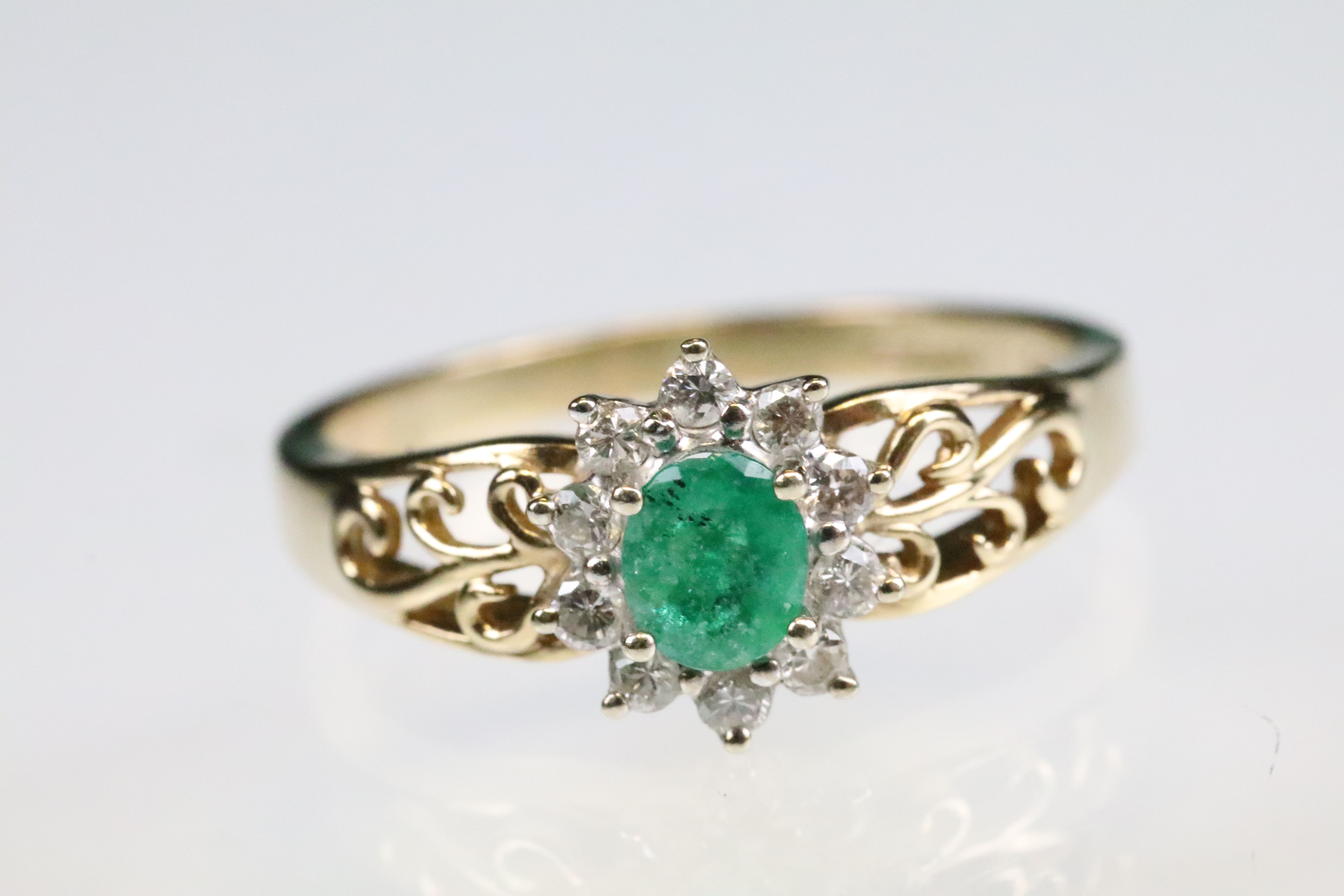 Emerald and diamond 9ct yellow and white gold flower head cluster ring, the oval mixed cut emerald - Image 2 of 6