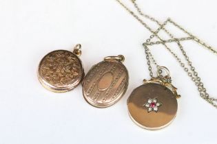 Three 9ct gold back and front locket pendants to include one set with red and white stones and two