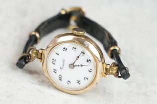 9ct gold cased ladies watch, white enamel dial, black Arabic numerals, poker hands, diameter