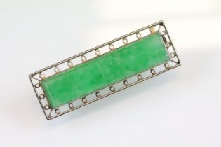 Art Deco jade yellow and white metal brooch, the rectangular faceted jade measuring approx 33 x 7.