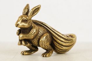 An ornamental Solid brass lucky fortune rabbit with bag.