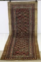 Serab Runner with diamond lozenge and flowerhead field within a camel outer border, cut and reduced,