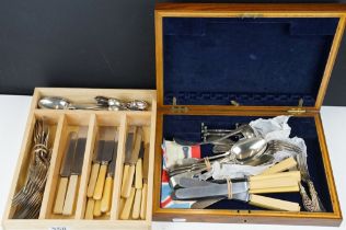 A collection of mixed silver plated cutlery contained within two boxes