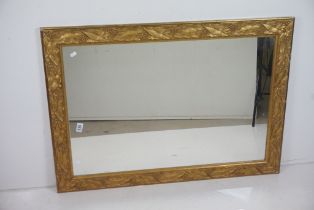 20th century Mirror, the gilt frame with moulded leaf and berry decoration, 75cm x 106cm