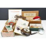A box of mixed vintage fishing tackle to include lures, flies and feathers.
