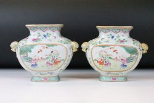 Pair of Chinese porcelain famille rose wall pocket vases having hand painted panels featuring