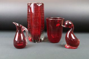 Four pieces of Whitefriars ruby glass to include a lobed control bubble vase, control bubble vase,