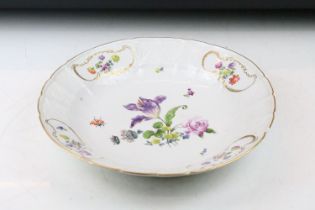 18th Century Meissen deep circular dish with central floral sprays, the moulded border with four