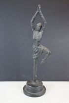 Bronze ballerina figure performing a pirouette, with blackened finish, raised on a pedestal base.