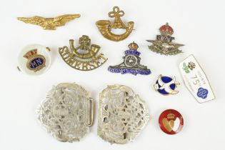 An antique silver plated nurses belt buckle together with a quantity of badges to include military