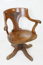 Late Victorian / Edwardian Oak Office Swivel Tub Chair, the shaped splat with carved panel, cast