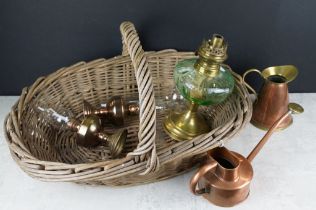 Three early 20th century oil lamps to include a brass example with green tinted glass font (approx